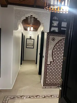a hallway with a hallway leading to a room at Apartement Mabrouka in Marrakech