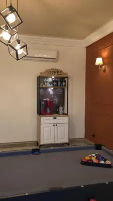 a ping pong table in a room with a counter at Entire Luxury Duplex Appart 3Bedroom 2Living Rooms in Top Center in Marrakech