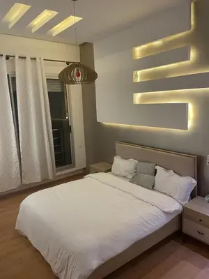 a bedroom with a white bed and a window at Oasis Luxury Villa Marrakesh in Marrakech
