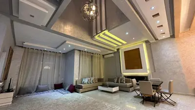 a living room with a couch and a table at Oasis Luxury Villa Marrakesh in Marrakech