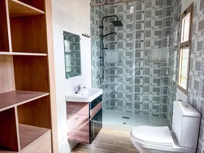a bathroom with a toilet and a sink and a shower at Villa with private pool in Marrakech
