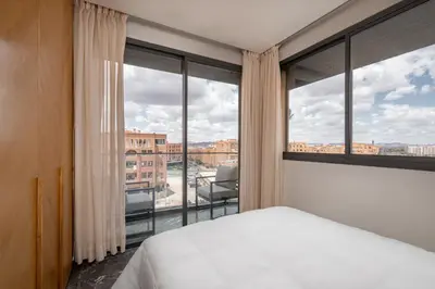 a bedroom with a bed and a large window at 3Br 2Ba Apartment in Marrakech in Marrakech