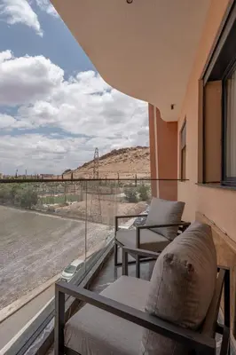 a room with a view of the desert from a window at 3Br 2Ba Apartment in Marrakech in Marrakech