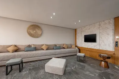 a living room with a couch and a tv at 3Br 2Ba Apartment in Marrakech in Marrakech