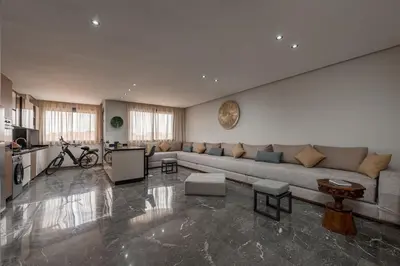 a living room with a couch and a table at 3Br 2Ba Apartment in Marrakech in Marrakech