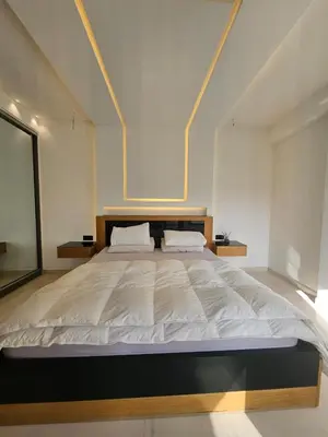 a large white bed in a white room at Luxury appartment hivernage in Marrakech