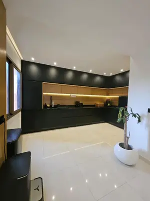 a living room with a black and white wall at Luxury appartment hivernage in Marrakech
