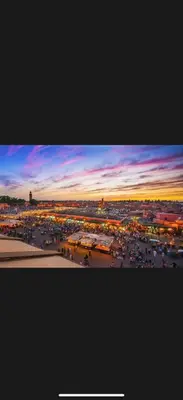 a view of a parking lot at sunset at Résidence touristique Marrakesh in Marrakech