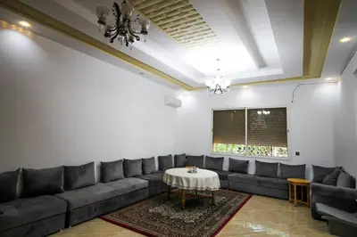 a living room with a couch and a table at Redmoon Villa & Riad in Marrakech