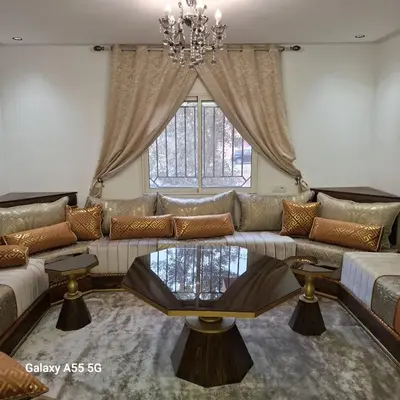 a living room with a couch and a glass table at Douira in Marrakech