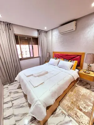 a bedroom with a large bed in a room at Gone app Marrakech in Marrakech