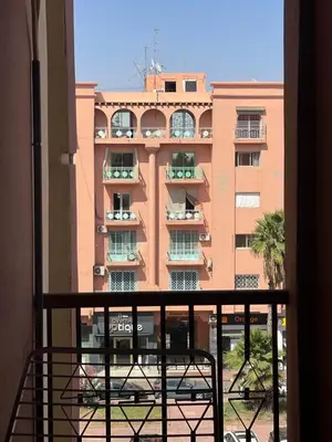 a view of a large building from a balcony at Gone app Marrakech in Marrakech