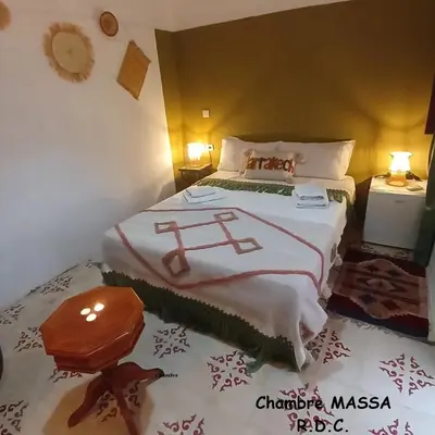 a bedroom with a bed with christmas decorations on it at Riad Dantella in Marrakech