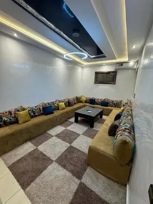a living room with a couch and a table at Piso en Marrakech in Marrakech