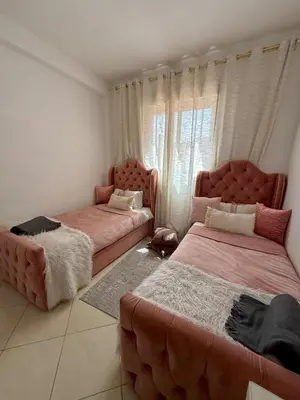 a bedroom with two beds and a couch at Marrakech stay in Marrakech