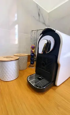 a black and white toaster sitting on top of a table at Peaceful one terrace suite, gueliz in Marrakech