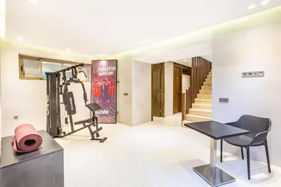 a room with a gym with a treadmill at Villa Zineb Confort, design et sérénité in Marrakech