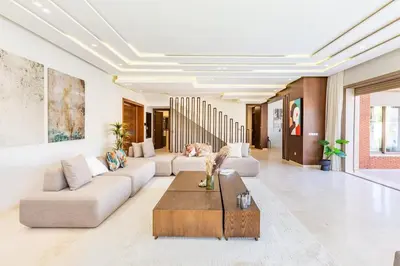 a living room with couches and a coffee table at Villa Zineb Confort, design et sérénité in Marrakech