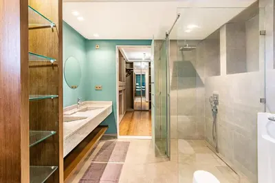 a bathroom with a glass shower and a sink at Villa Zineb Confort, design et sérénité in Marrakech