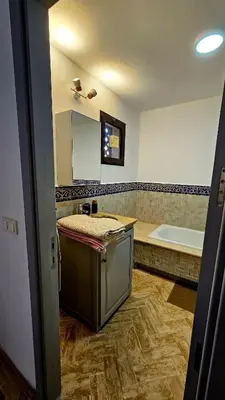 a bathroom with a sink and a bath tub at Votre Villa Soleil et Chaleureuse in Marrakech