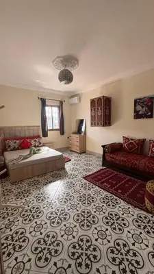 a living room with a bed and a couch at traditional apartment in Marrakech