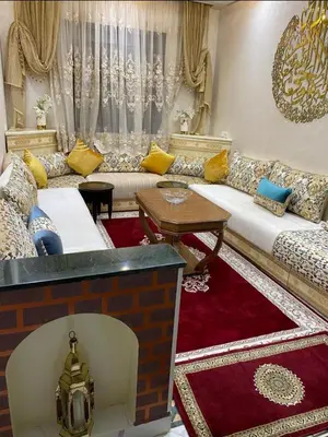 a living room with a couch and a table at Séjour agréable à marrakech in Marrakech