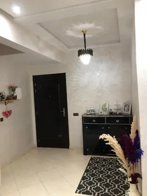 a room with a black door and a black cabinet at Appartement hay mabroka in Marrakech