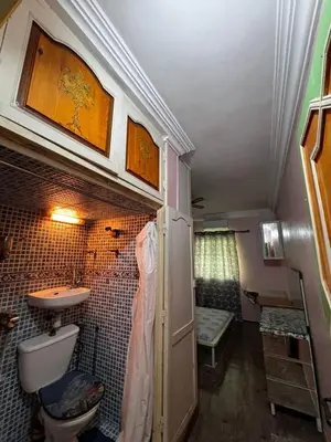 a small bathroom with a sink and a toilet at Oum rabiaa in Marrakech