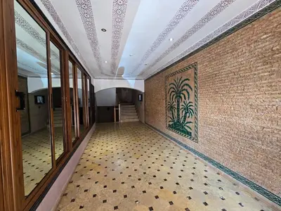 an empty hallway with a tile floor and a ceiling at Appartement typique Marrakech in Marrakech