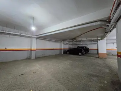a parking garage with a car parked in it at Appartement typique Marrakech in Marrakech