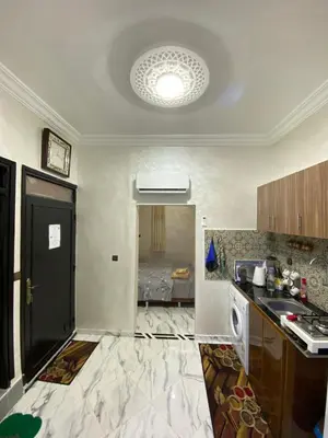 an empty kitchen with a sink and a stove at Cosy, Calm Apartment - Wi-Fi, AC & NETFLIX in Marrakech