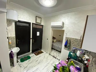 a bathroom with a sink and a toilet and a sink at Cosy, Calm Apartment - Wi-Fi, AC & NETFLIX in Marrakech