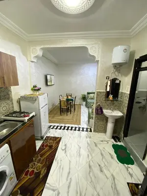 a kitchen with a sink and a counter top at Cosy, Calm Apartment - Wi-Fi, AC & NETFLIX in Marrakech