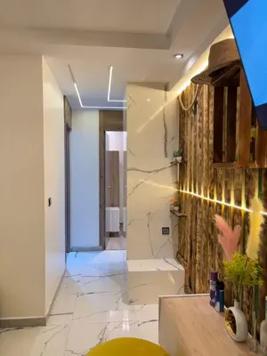 a bathroom with a large marble wall at Apartment with pool in Marrakech