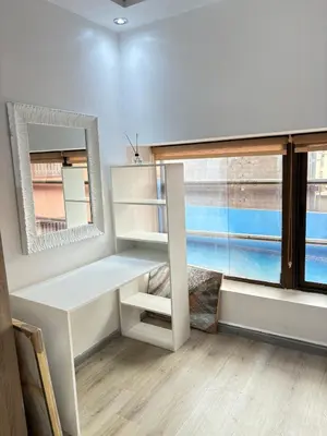 a room with a desk and a large window at Apartment with pool in Marrakech