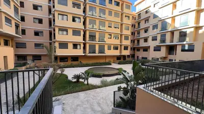 a view of an apartment complex from a balcony at Éden Luxueux au Cœur de la Ville in Marrakech