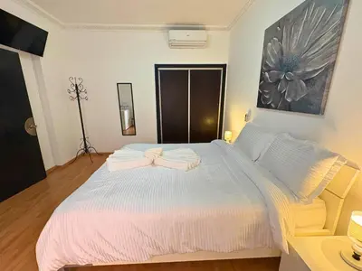 a bedroom with a large bed with two towels on it at Trésor de Gueliz avec Piscine et Terrasse in Marrakech