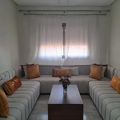 a living room with a couch and a table at Luxury 2 Bedrooms Apartment in Marrakech