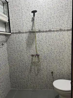 a shower in a bathroom with a toilet at dar soukaina in Marrakech