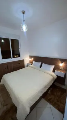 a bedroom with a large white bed with two pillows at Peaceful Marrakech Stay Cozy Well Located in Marrakech