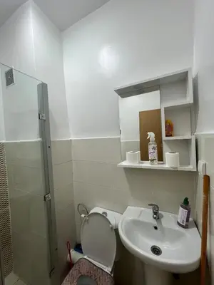 a bathroom with a toilet and a sink and a shower at Peaceful Marrakech Stay Cozy Well Located in Marrakech