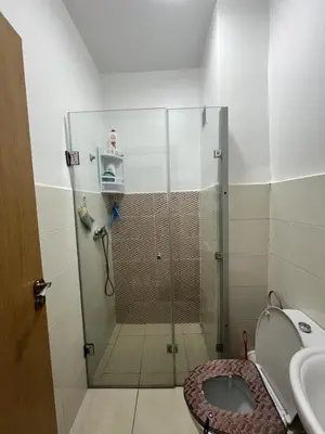 a bathroom with a shower with a toilet and a sink at Peaceful Marrakech Stay Cozy Well Located in Marrakech