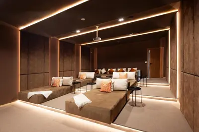 a living room with couches and chairs and lights at Villa Tiaré Luxury, pool, staff and private cinema in Marrakech