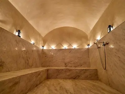 a large bathroom with a shower and a tub at Villa Tiaré Luxury, pool, staff and private cinema in Marrakech