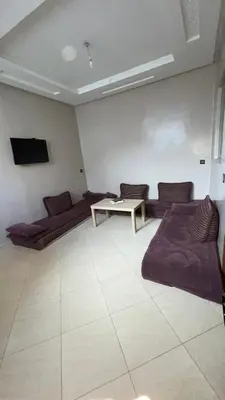 a living room with two couches and a table at Marrakech,Massira1 in Marrakech