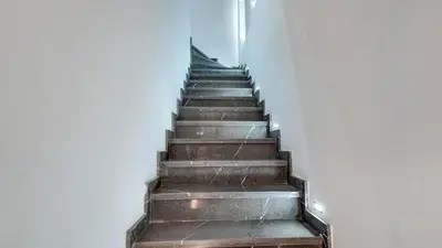 a stairway leading up to a white building at Duplex Cheryn Heated rooftop pool in Marrakech