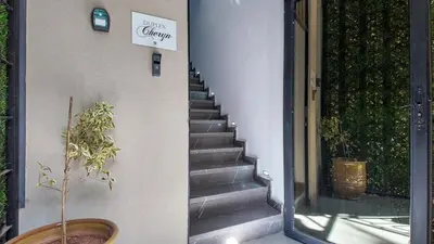 a staircase with a sign on the side of a building at Duplex Cheryn Heated rooftop pool in Marrakech