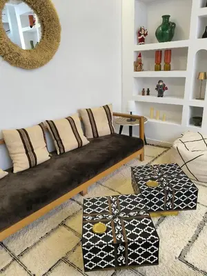 a living room with a couch and a mirror at Riad MAGE Marrakech in Marrakech