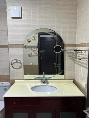 a bathroom with a sink and a mirror at Super apt plein centre de Gueliz hyper bien placer pour votre séjour tout à proximité resto café transport in Marrakech