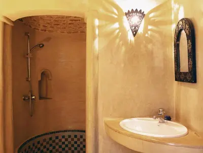 a bathroom with a sink and a shower at Riad Bleu-Azrak in Marrakech
